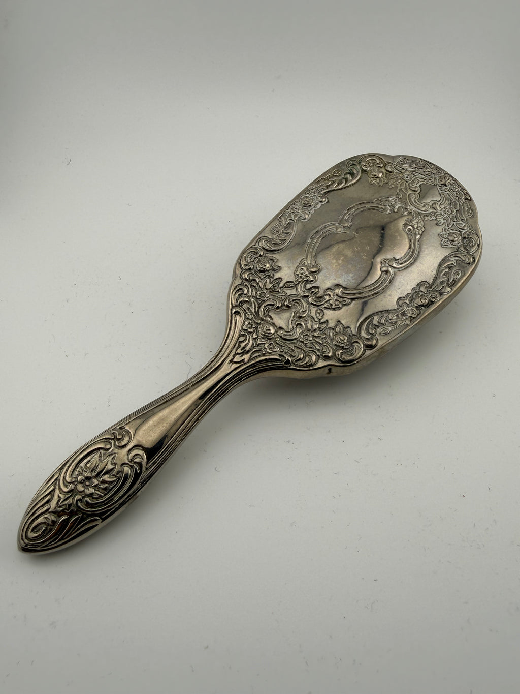 Antique Rococo Silver-Plated Vanity Hair Brush with Deeply Embossed Scrollwork and Rose Motifs